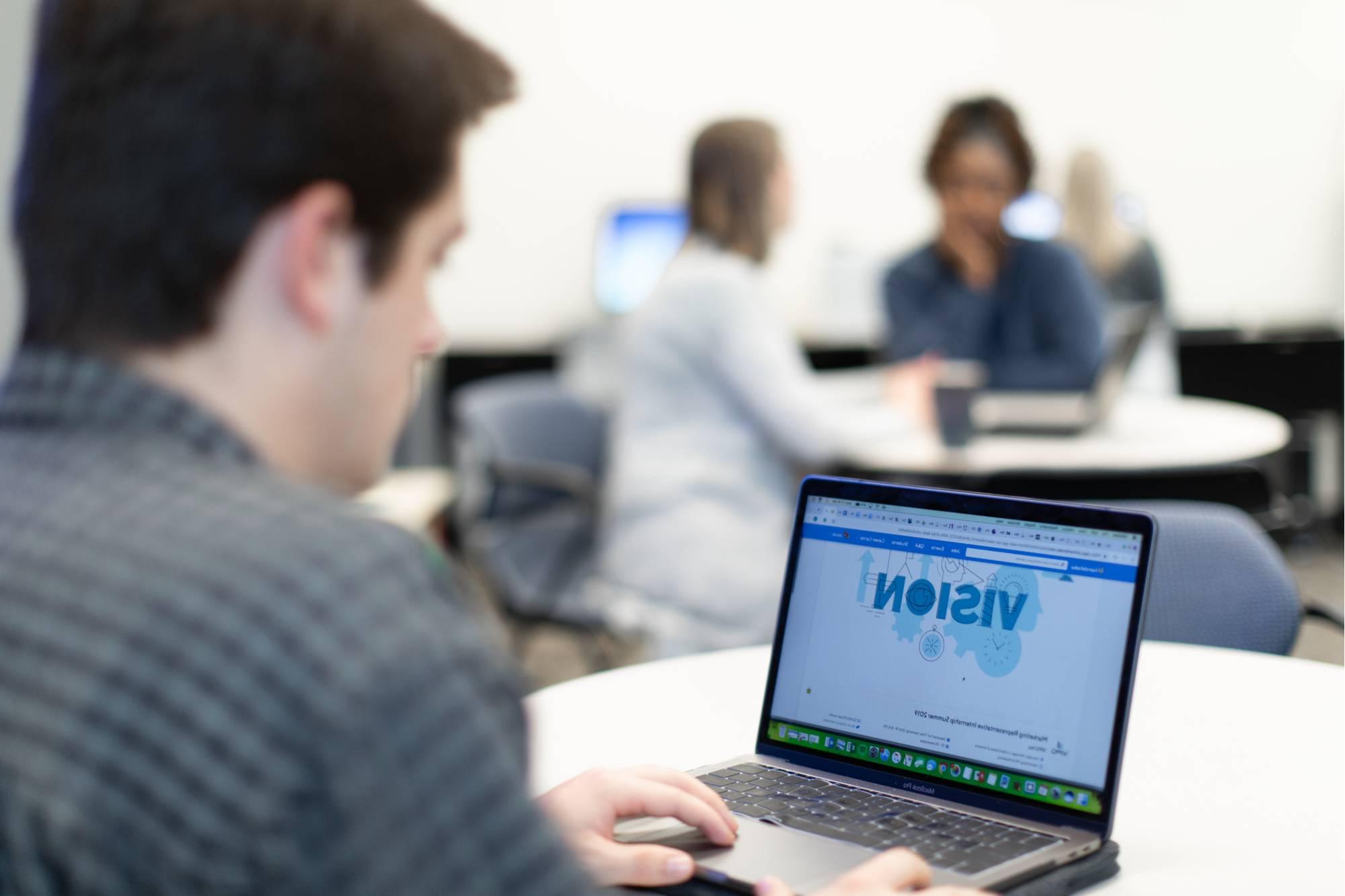 man looking at laptop